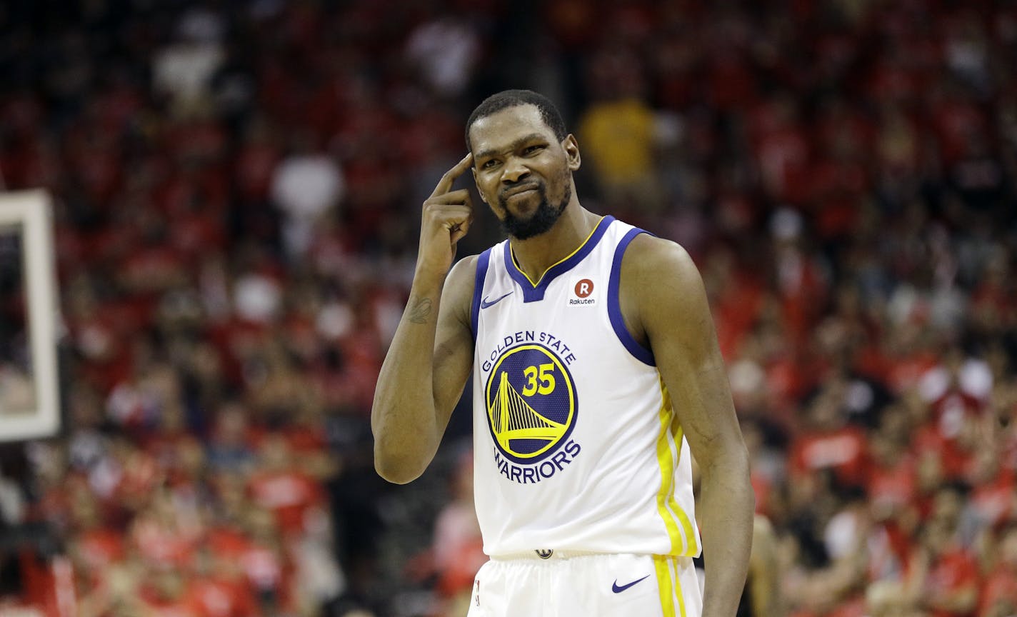 Golden State Warriors forward Kevin Durant (35) reacts after a play against the Houston Rockets during the second half in Game 7 of the NBA basketball Western Conference finals, Monday, May 28, 2018, in Houston. (AP Photo/David J. Phillip)