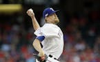 Texas Rangers relief pitcher Jake Diekman throws to the Toronto Blue Jays during the ninth inning of Game 1 of baseball's American League Division Ser