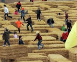 Children negotiate a hay bale maze at Sever's Corn Maze in Shakopee.