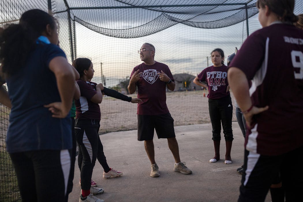 J.J. Suarez, president and head coach of Uvalde Little League, speaks with players after batting practice,