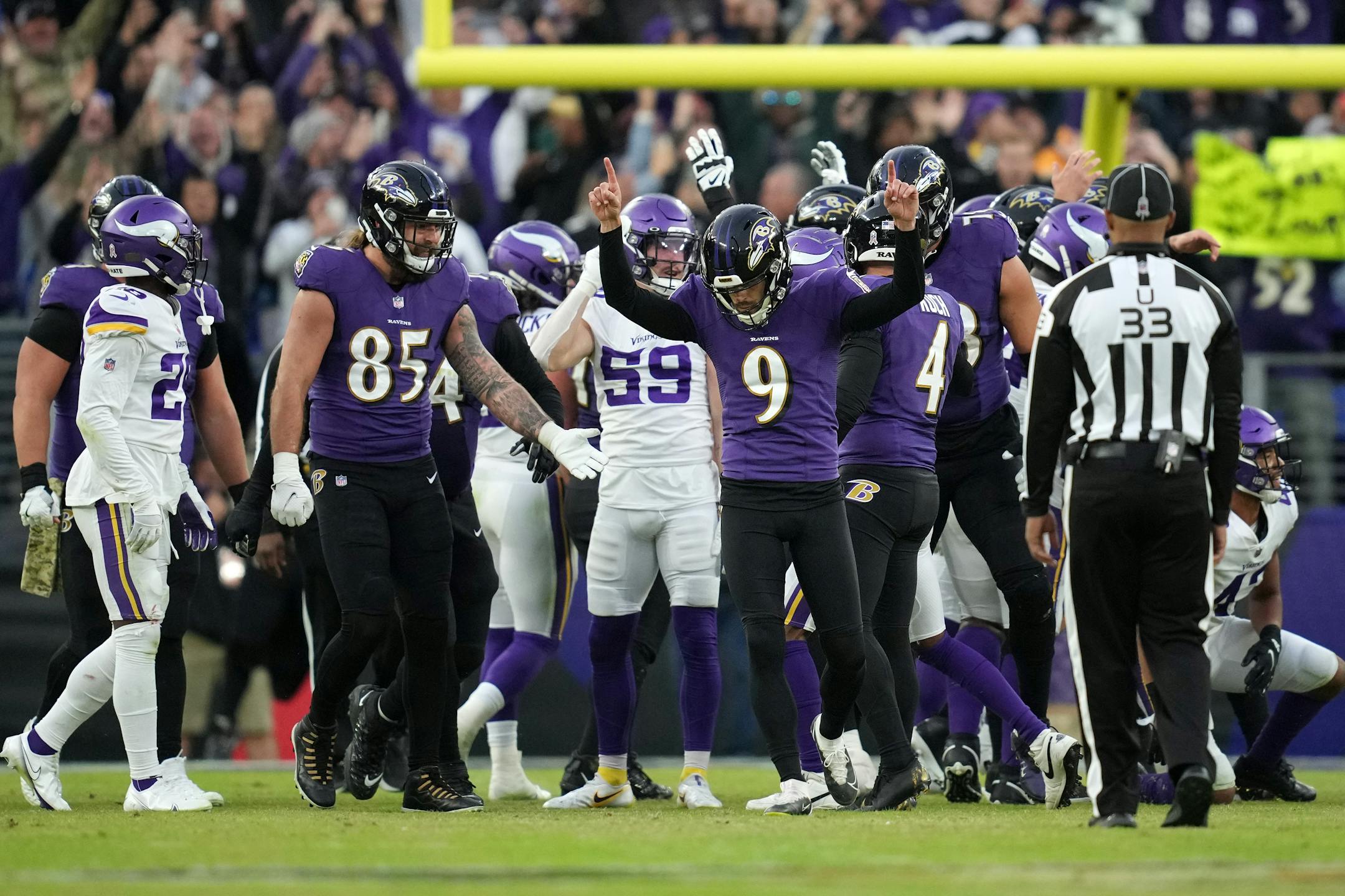 Ravens kicker Justin Tucker (9) reacts after making a game-winning field goal in overtime.