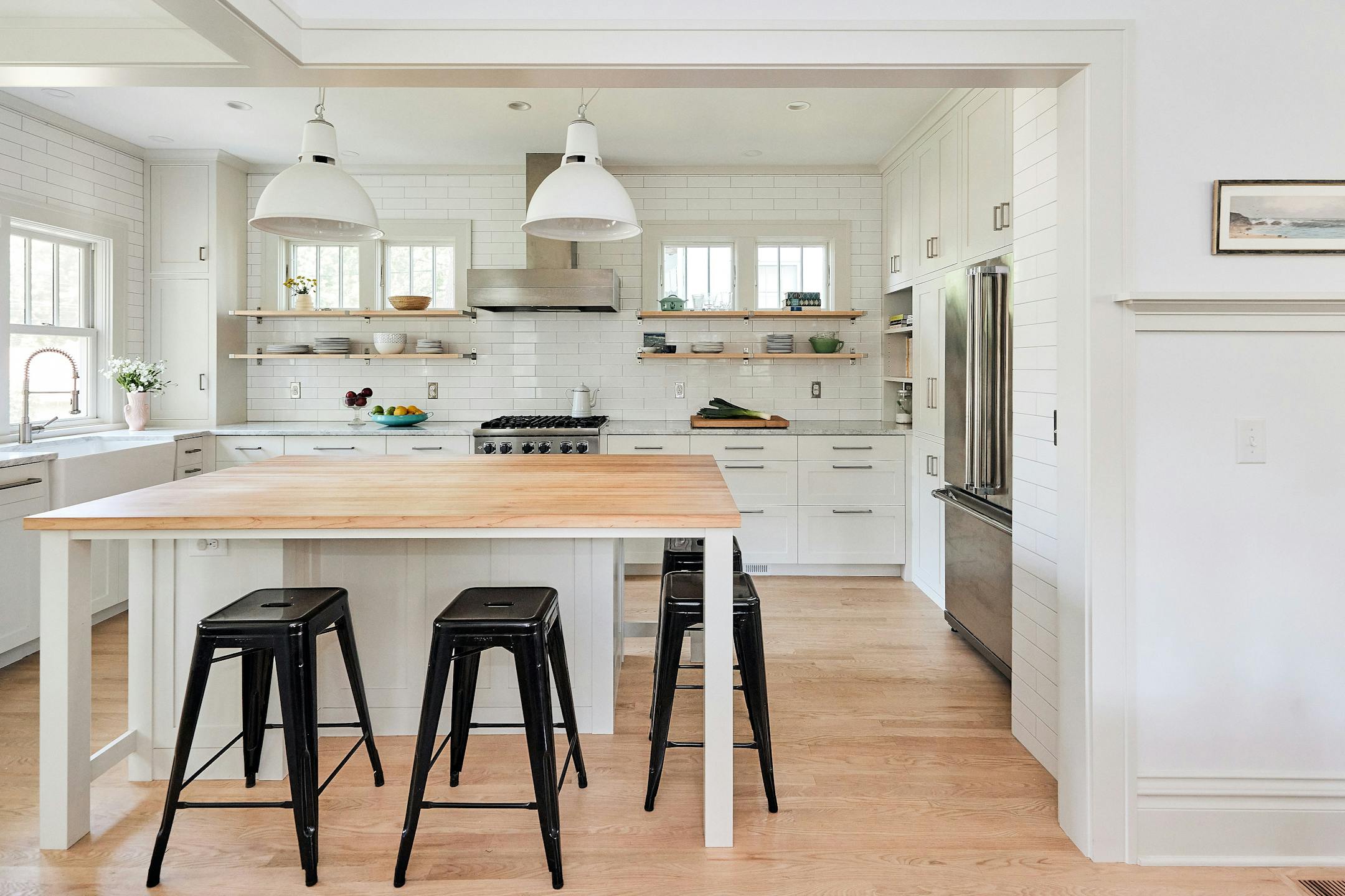 Merriam Park Cottage Renewal, a 2024-2025 Home of the Month winner by Albertsson Hansen Architecture and Interior Design, is a modest 1 1/2-story house that gets an overhaul while maintaining its vintage feel. An addition to a 1916 St. Paul home increases the kitchen’s square footage, adds a small covered porch with easier access to the backyard and expands the second floor to accommodate three bedrooms. Existing spaces are opened up to create better flow between gathering areas. White shaker-style cabinets and trim, as well as tall windows, add airiness and lightness.