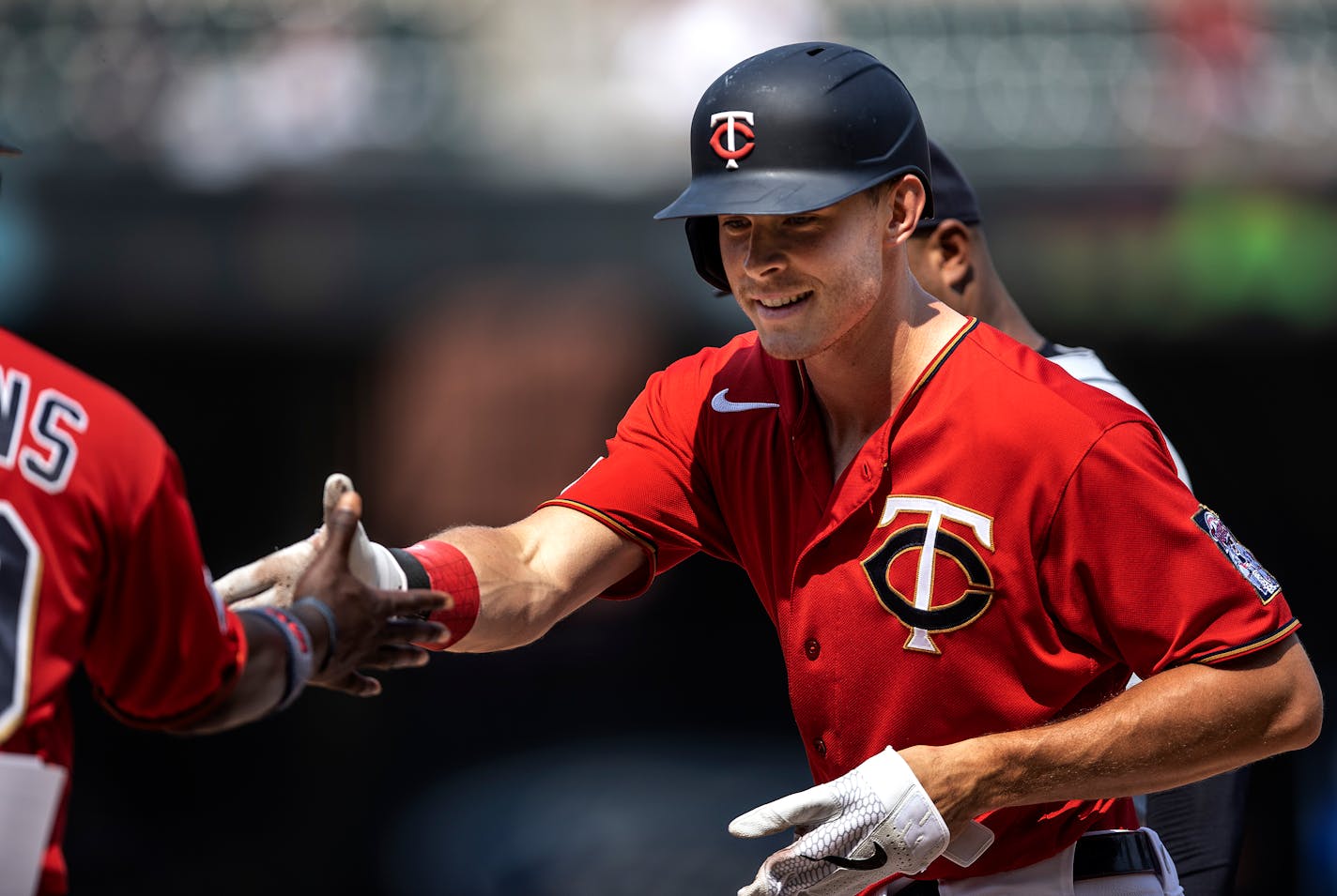 Minnesota Twins Max Kelpler shook hands with first base coach Tommy Watkins after getting a hit .] Jerry Holt •Jerry.Holt@startribune.com