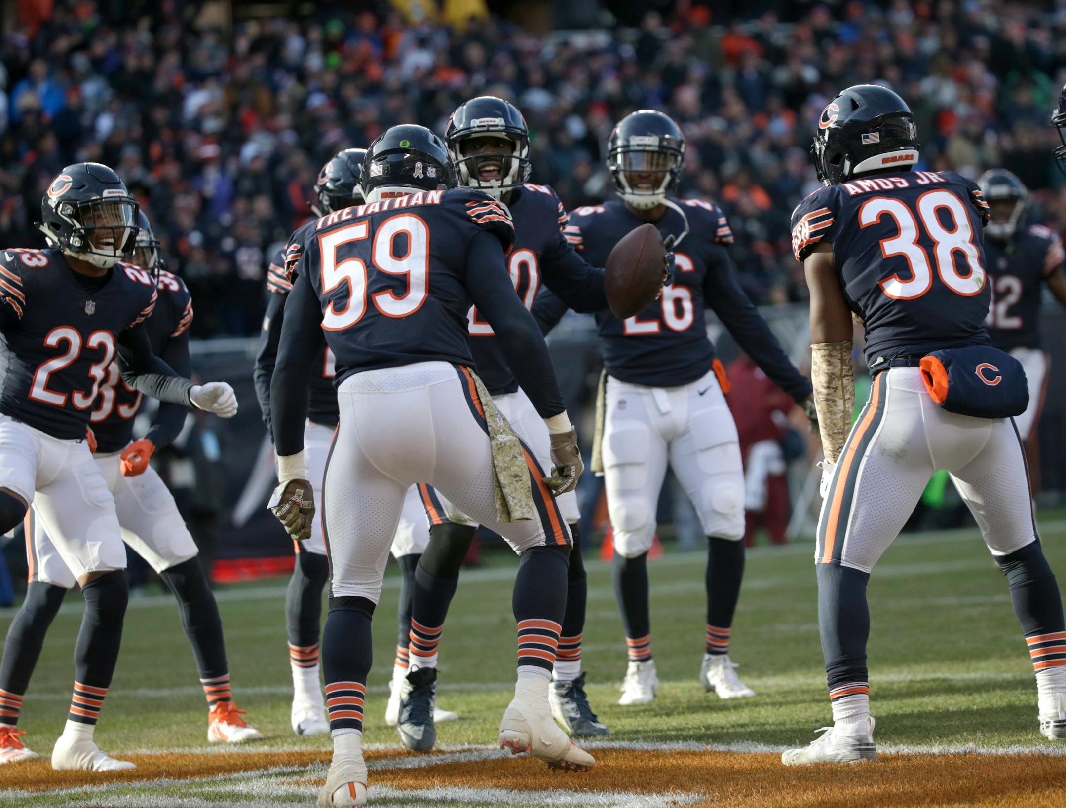 Bears cornerback Prince Amukamara (20) celebrated his interception against the Lions with his teammates during the second half Sunday.