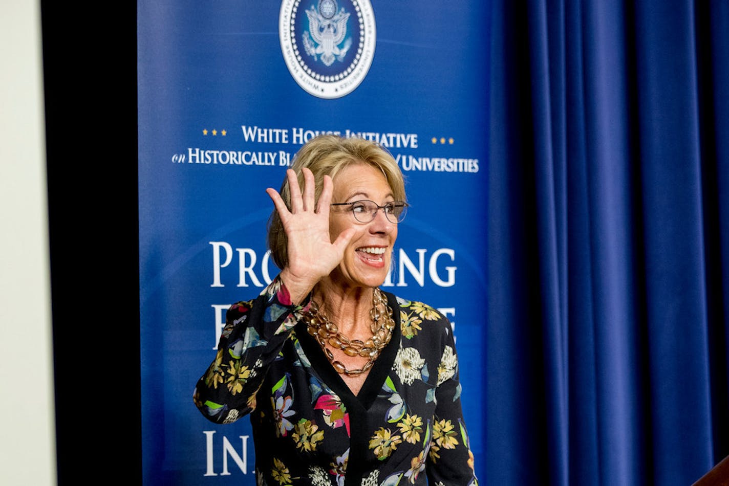 Education Secretary Betsy DeVos waves as she steps away from the podium after speaking at the White House Summit on Historically Black Colleges and Universities on Monday.