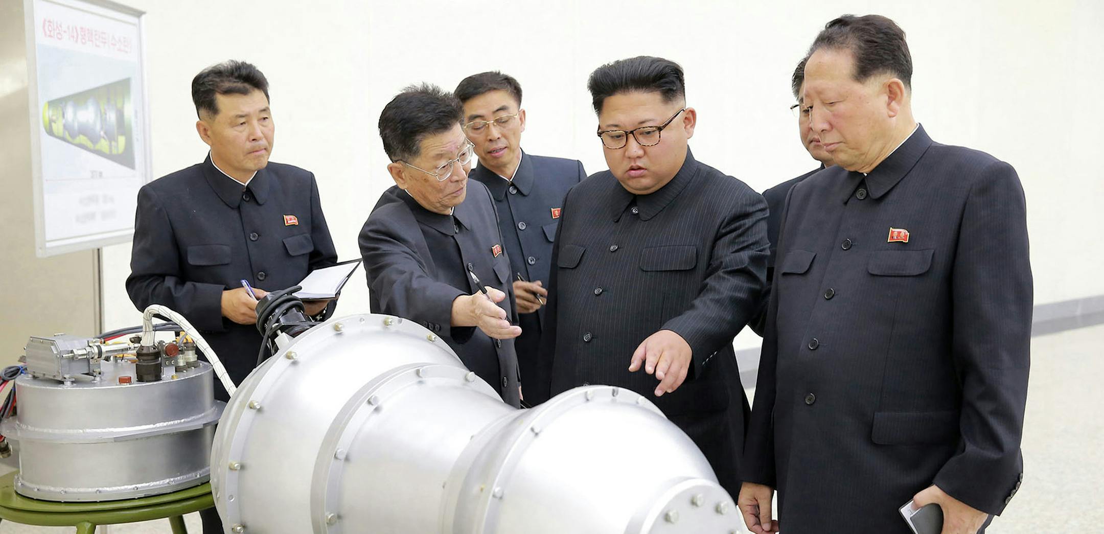 FILE - This undated file photo distributed on Sunday, Sept. 3, 2017, by the North Korean government, shows North Korean leader Kim Jong Un, second from right, at an undisclosed location in North Korea. North Korea detonates its strongest ever nuclear test explosion and U.S. President Donald Trump takes to Twitter to criticize both North and South Korea, China and ìany country doing businessî with Pyongyang. But the tweet storm will be noticed in Asia as much for whatís missing as