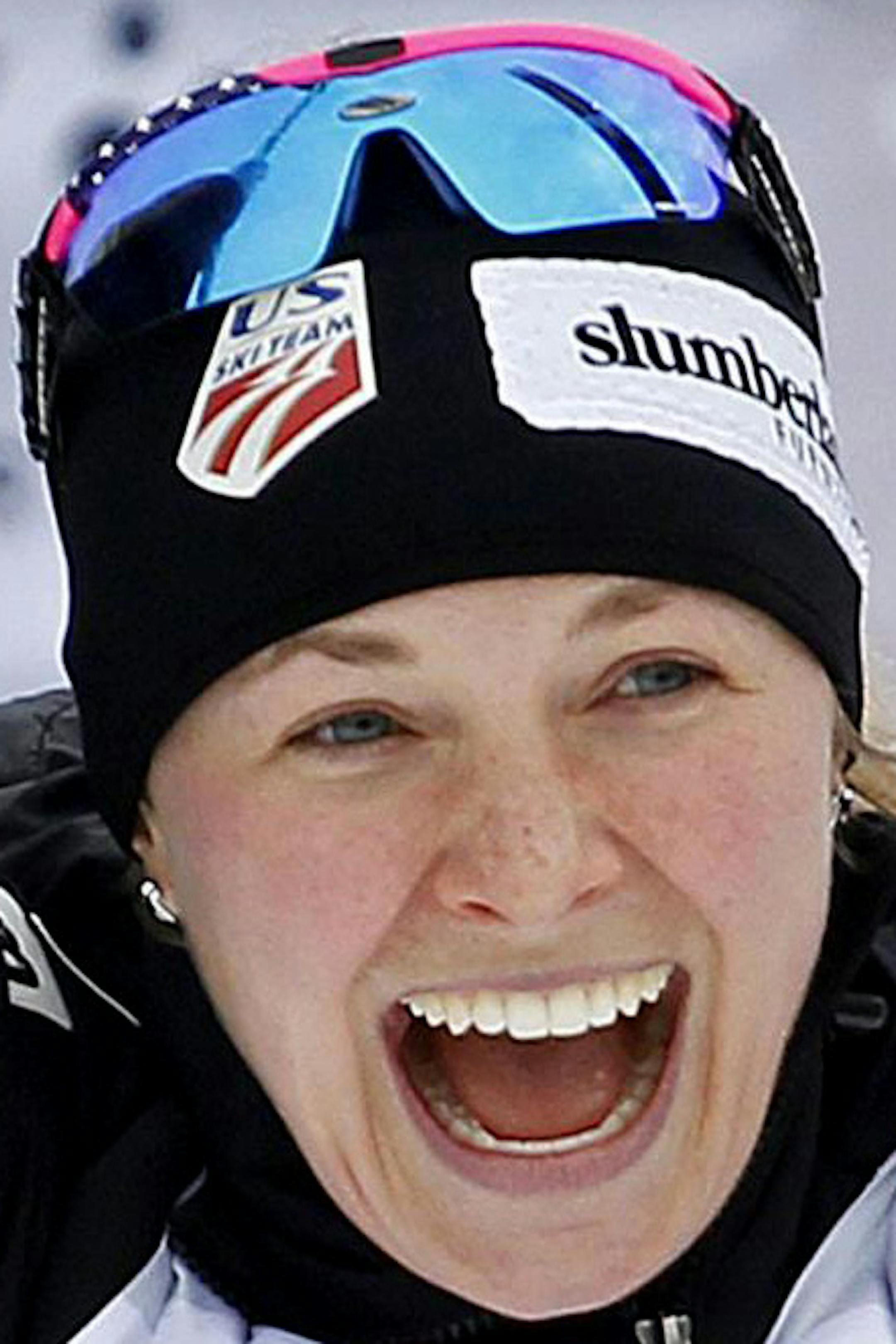 Jessica Diggins of The United States celebrates in the finish area after winning the Tour de Ski, women's 5-kilometer free pursuit cross-country ski event, in Dobbiaco (Toblach), Italy, Friday, Jan. 8, 2016. (Andrea Solero/Ansa via AP)