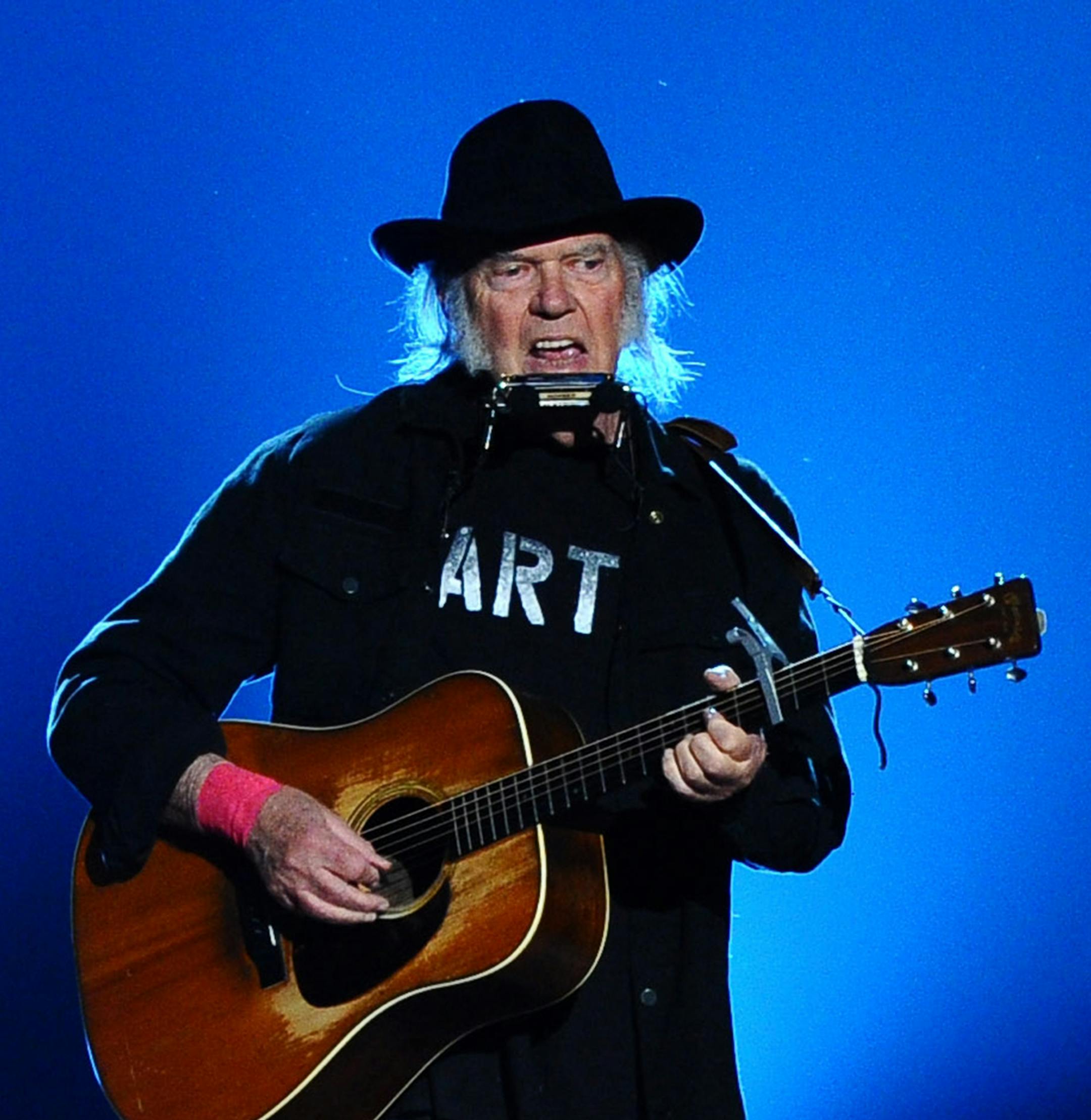 Neil Young performs on stage at the 2015 MusiCares Person of the Year show at the Los Angeles Convention Center on Friday, Feb. 6, 2015, in Los Angeles. (Photo by Vince Bucci/Invision/AP) ORG XMIT: INVW