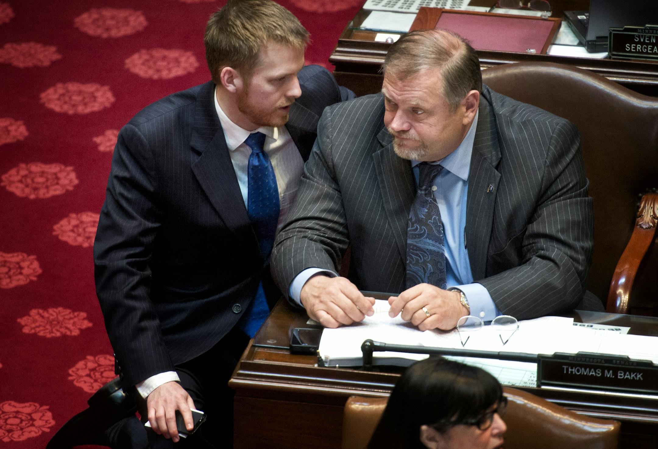 Senate Majority Leader Tom Bakk talked with DFL communications director Amos Briggs after the first tax bill vote in which the bill was defeated. The Senate debated the tax bill Monday, April 29, 2013 in the Senate chamber at the State Capitol. ] GLEN STUBBE * gstubbe@startribune.com