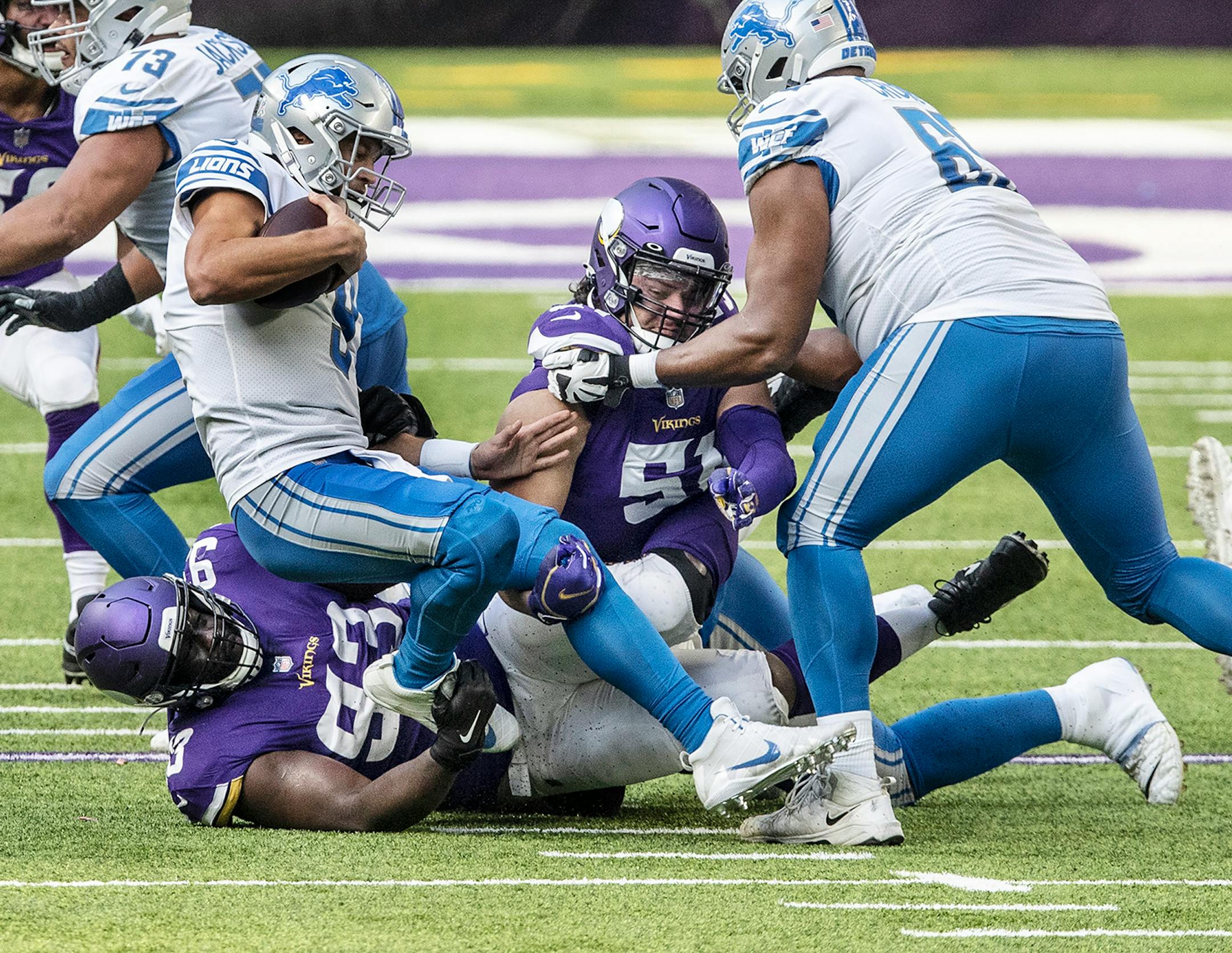 Detroit Lions quarterback Matthew Stafford (9) was sacked by Minnesota Vikings defensive tackle Shamar Stephen (93) in the first quarter.