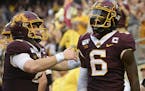 Gophers wide receiver Tyler Johnson (6) celebrated with quarterback Tanner Morgan (2) after their game-winning touchdown pass with :13 left in the fou