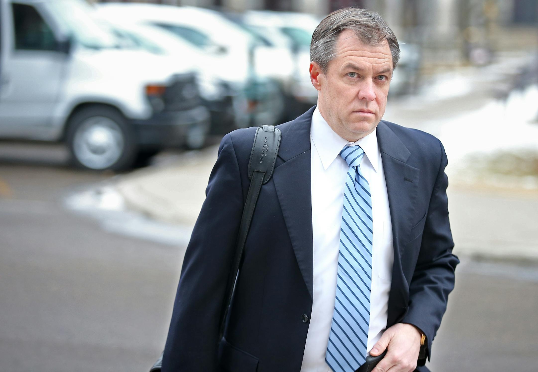 Prosecutor Richard Dusterhoft made his way into the Stearns County District Courthouse for the opening statements in the Brian G. Fitch trial, Tuesday, January 20, 2015. Brian G. Fitch is on trial for killing Officer Scott Patrick last year.