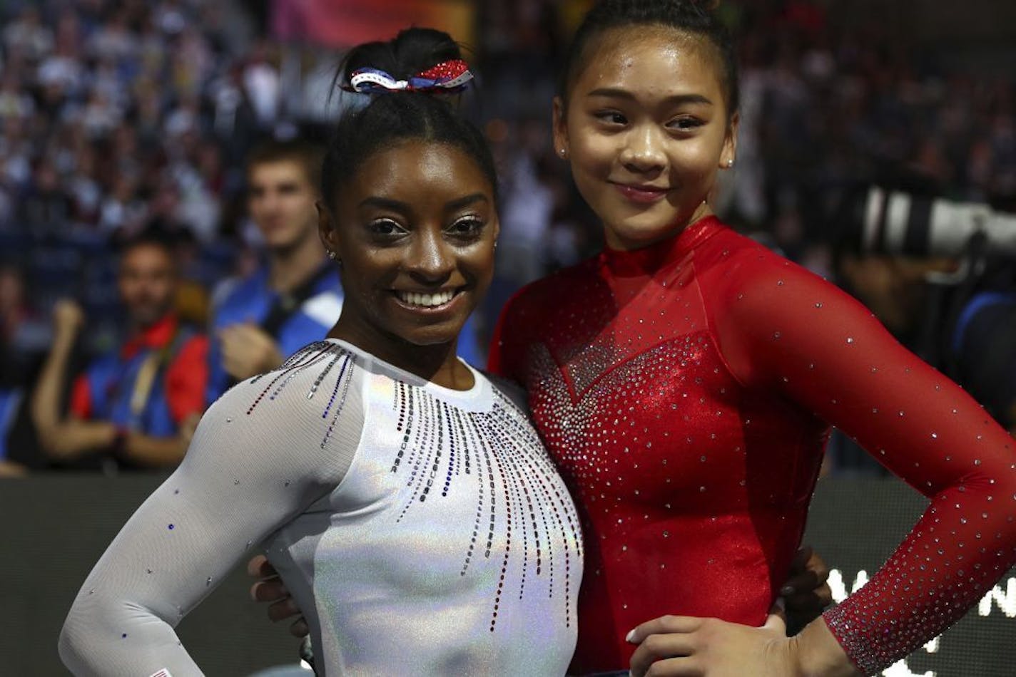 Gold medal winner Simone Biles of the U.S., left, and her team mate Sunisa Lee pose after the women's all-around final at the Gymnastics World Championships in Stuttgart, Germany, Thursday, Oct. 10, 2019.