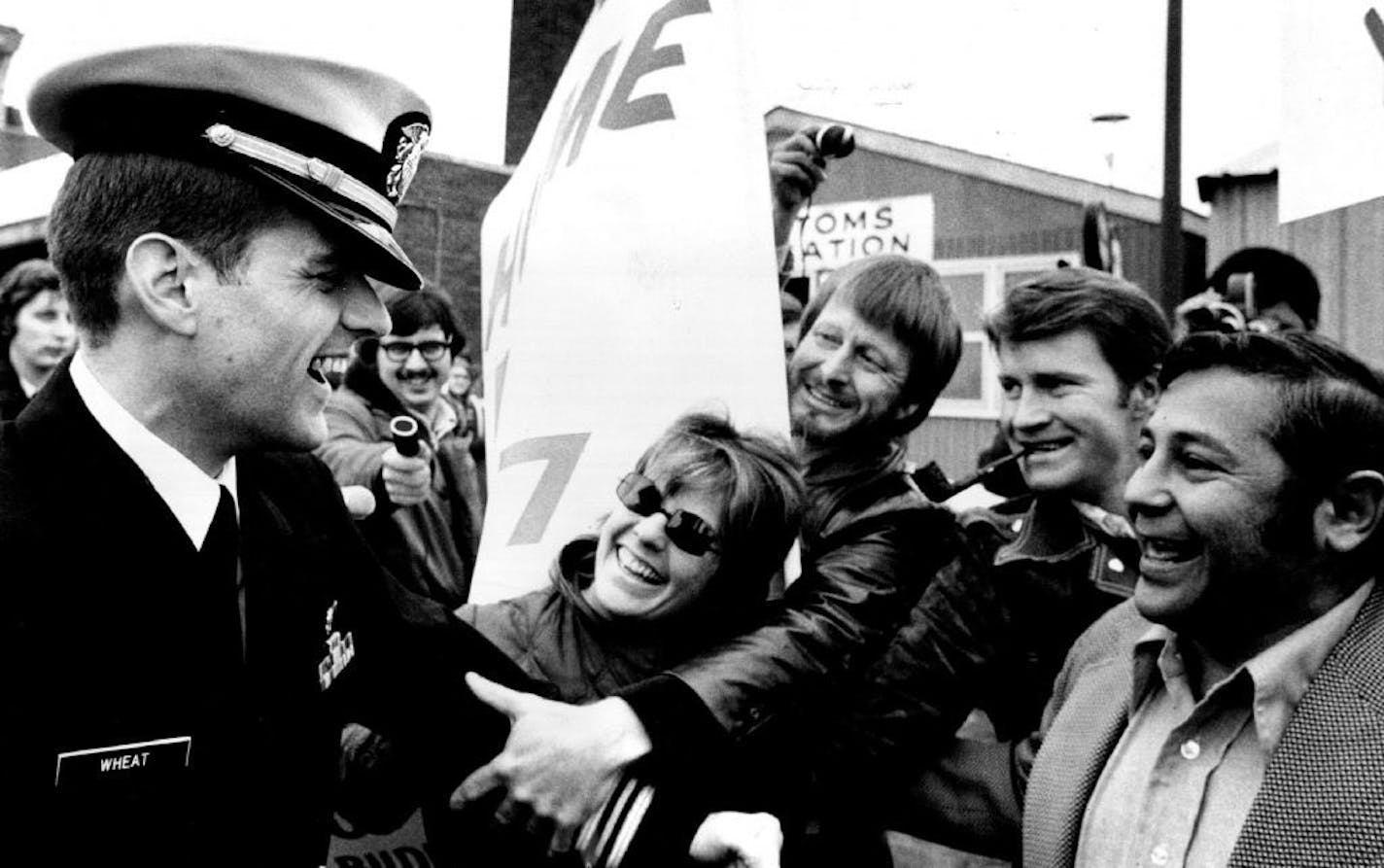 February 28, 1973 Fellow members of the Duluth Central High School greeted Lt. Cmdt. David Wheat at the airport. It was a reunion of Duluth Central's Class of '57, a gathering together again of the Duluth Poker Association and a celebration of Christmas, all wrapped into one big happy party here Tuesday. But most important, it was the day that Lt. Cmdr. David R. Wheat, more than seven years a prisoner of the North Vietnamese, returned home. Wheat was shot down over North Vietnam on Oct. 17, 1965