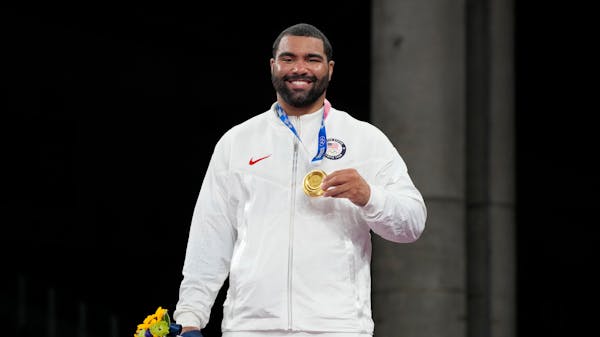 United States' Gable Dan Steveson celebrates with his gold medal during the victory ceremony for men's freestyle 125kg wrestling at the 2020 Summer Ol