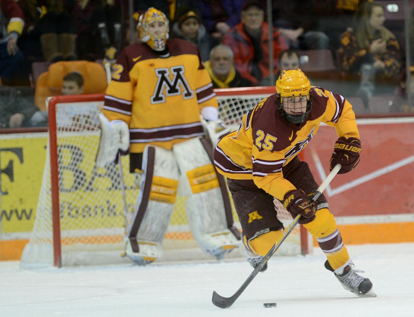 Gophers forward Justin Kloos takes the puck away from the net.] During the first period. BRIDGET BENNETT SPECIAL TO THE STAR TRIBUNE � bridget.bennett@startibune.com Gophers versus Michigan State on Friday, Feb. 27, 2015 at Mariucci Arena at the University of Minnesota. Score after first period 0-0 904192 UPUK022815