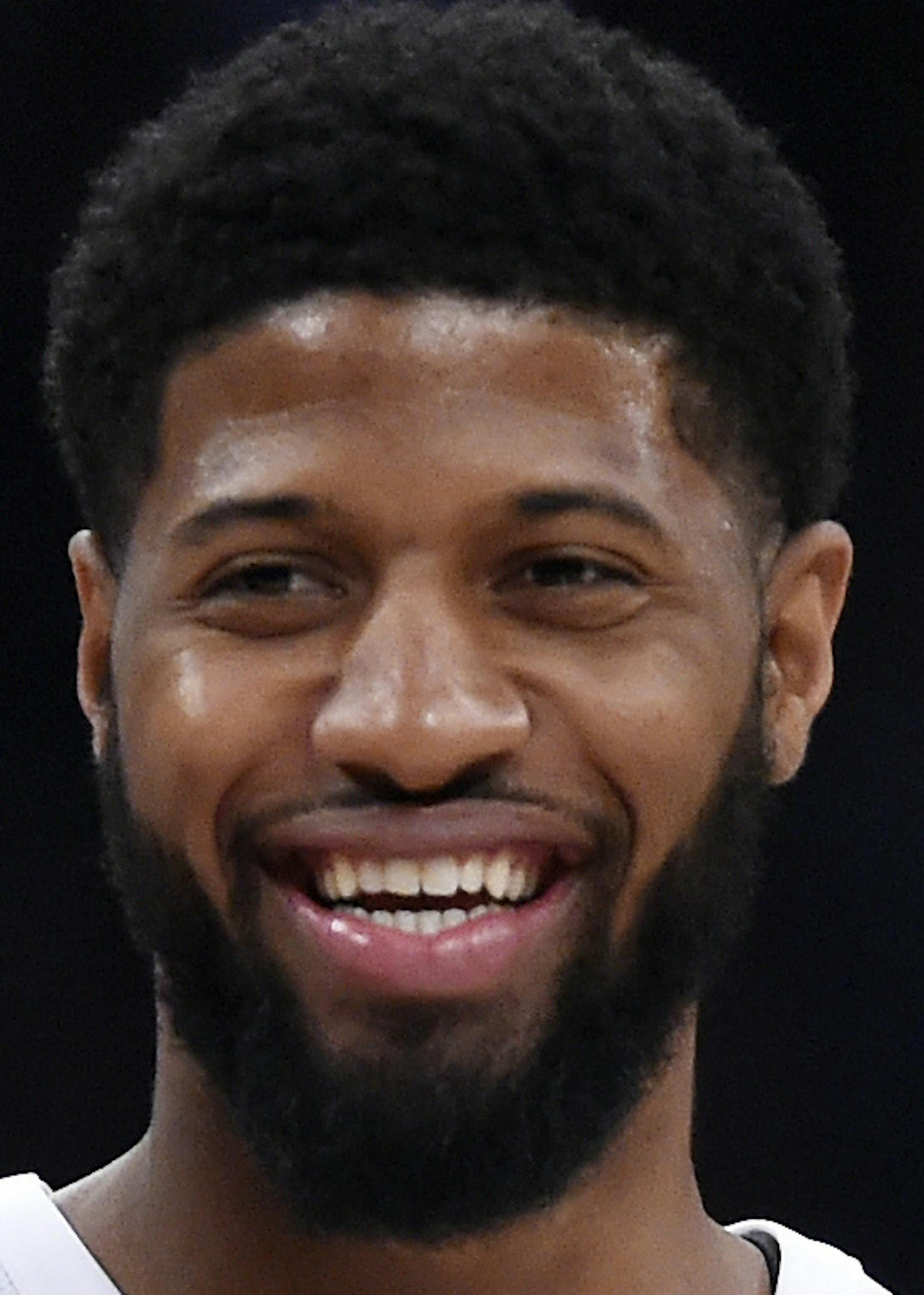 Team Stephen's Karl-Anthony Towns, left, of the Minnesota Timberwolves, and Team LeBron's Paul George, of the Oklahoma City Thunder, talk during the first half of an NBA All-Star basketball game, Sunday, Feb. 18, 2018, in Los Angeles. (AP Photo/Chris Pizzello)