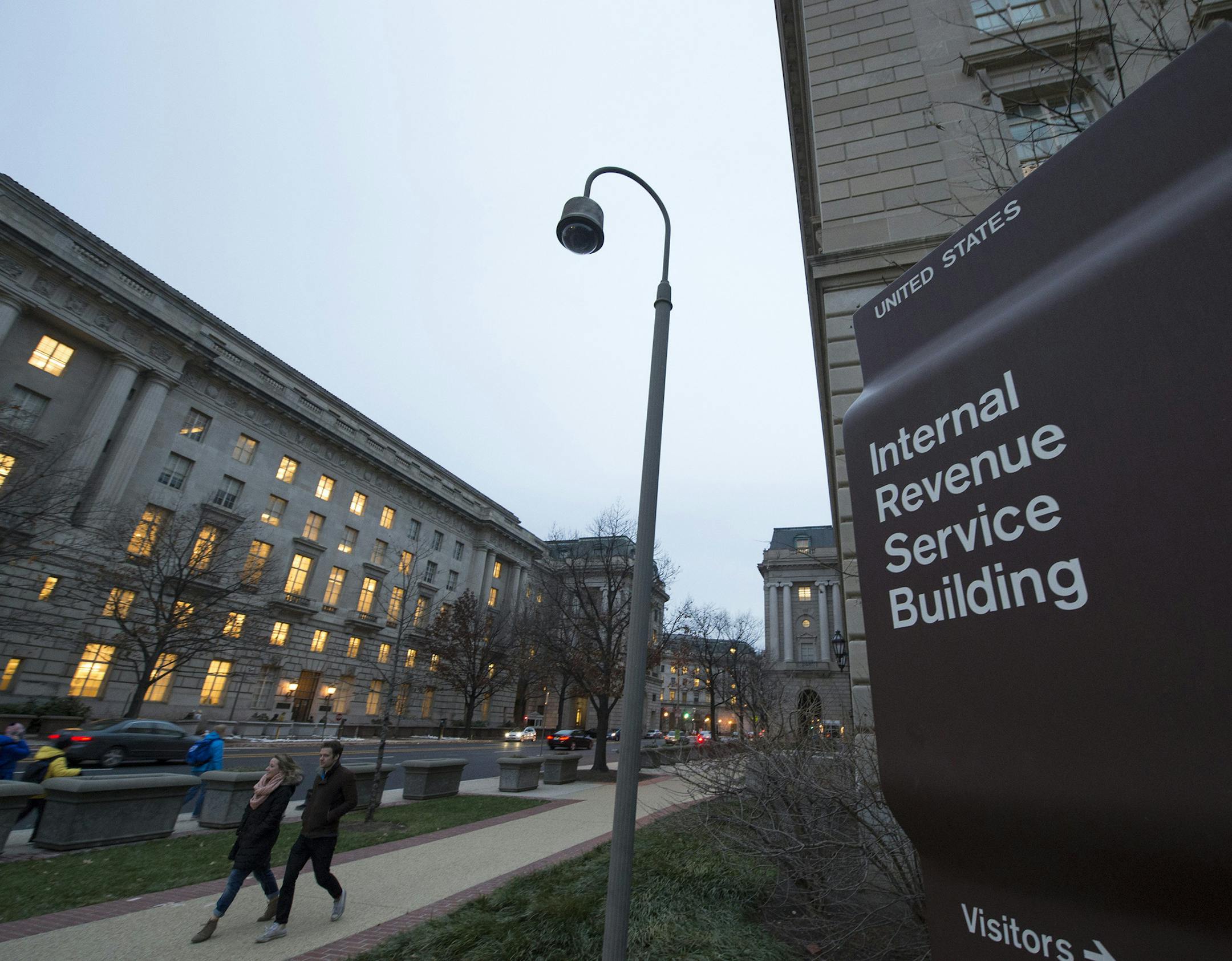 Workers enter the IRS building on Dec. 11, 2014, in Washington, D.C. The IRS has been making a full-court press this summer to alert tax professionals that cyber crooks are out to steal taxpayer information from their digital files. (Molly Riley/McClatchy DC/TNS) ORG XMIT: 1209172