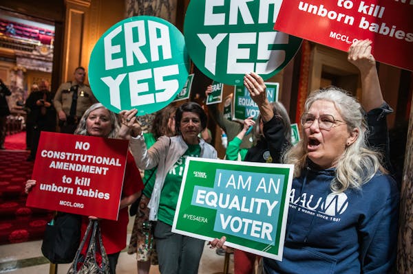 Protesters gather outside the Senate chambers after an ERA bill was heard in committee at the Minnesota State Capitol in St. Paul on May 6.