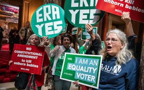 Protesters gather outside the Senate chambers after an ERA bill was heard in committee at the Minnesota State Capitol in St. Paul on May 6.