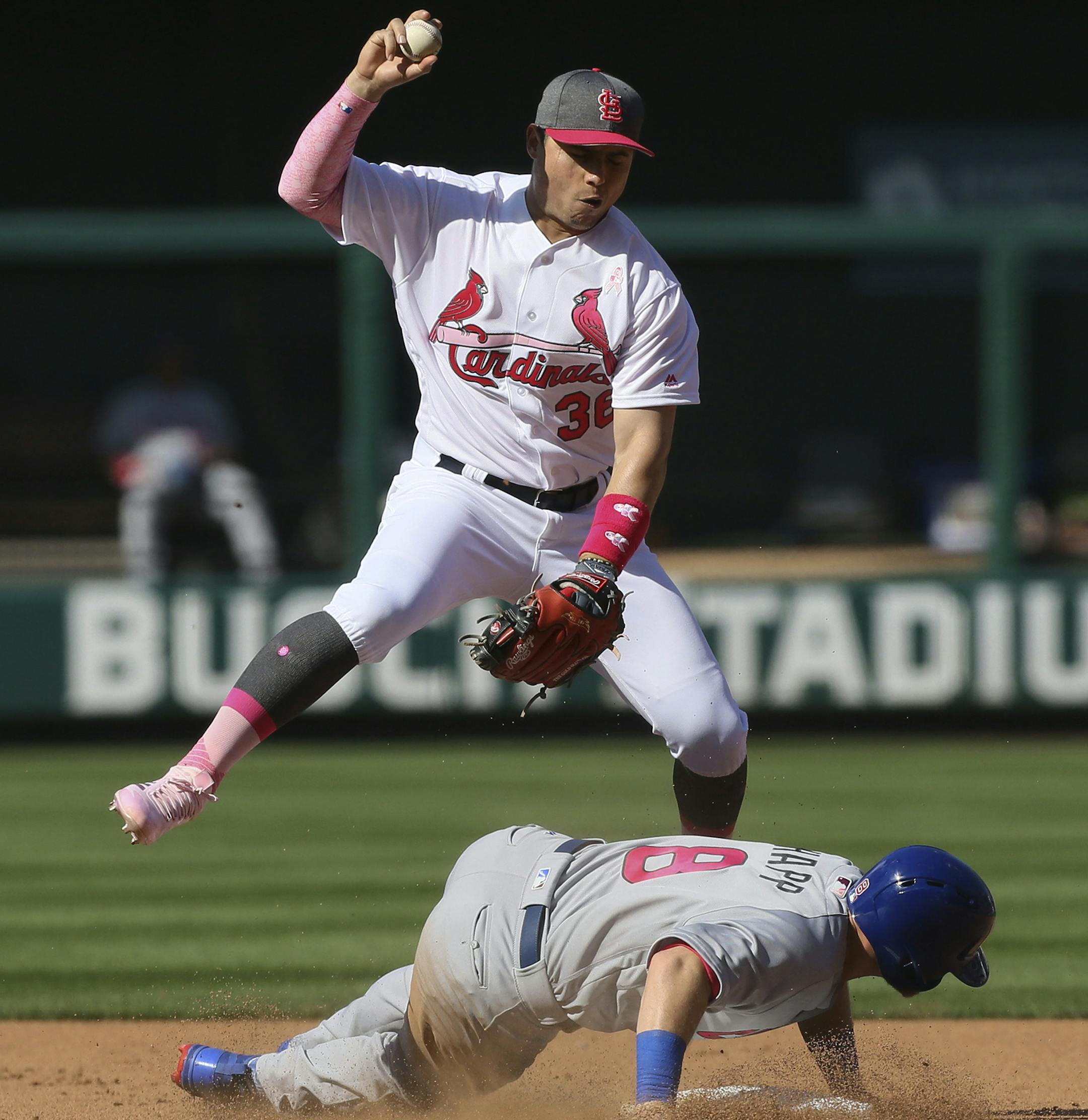 St. Louis Cardinals shortstop Aledmys Diaz forces out Chicago Cubs' Ian Happ and the batter, Anthony Rizzo, was also ruled out on a slide interference call to end the top of the fifth inning of a baseball game Saturday, May 13, 2017, at Busch Stadium in St. Louis. (Chris Lee/St. Louis Post-Dispatch via AP) ORG XMIT: MOSTP327
