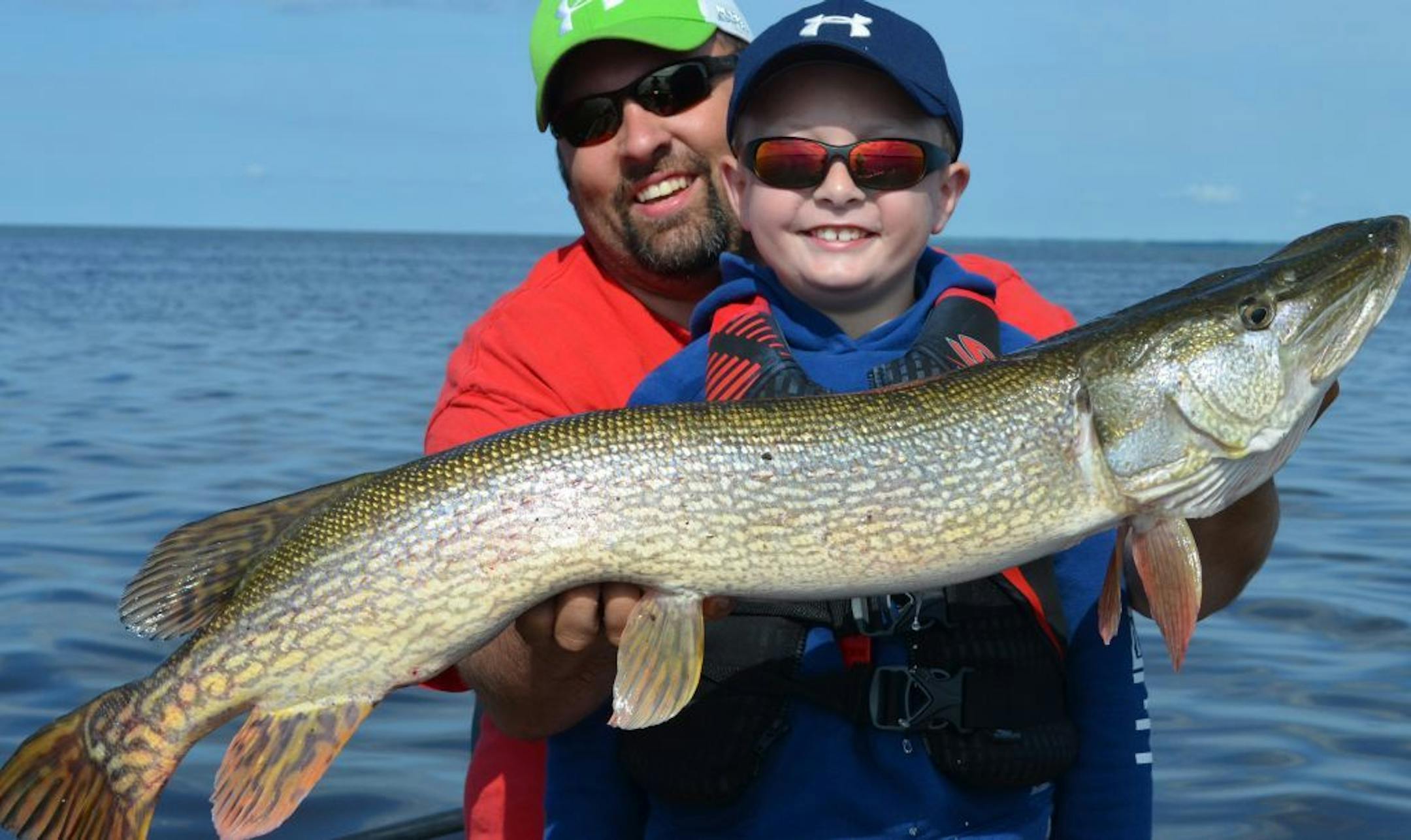 Gavin Moen, 7, of Grand Rapids, Minn., and his dad Derreck, with a 40-inch northern Gavin caught on Upper Red Lake.