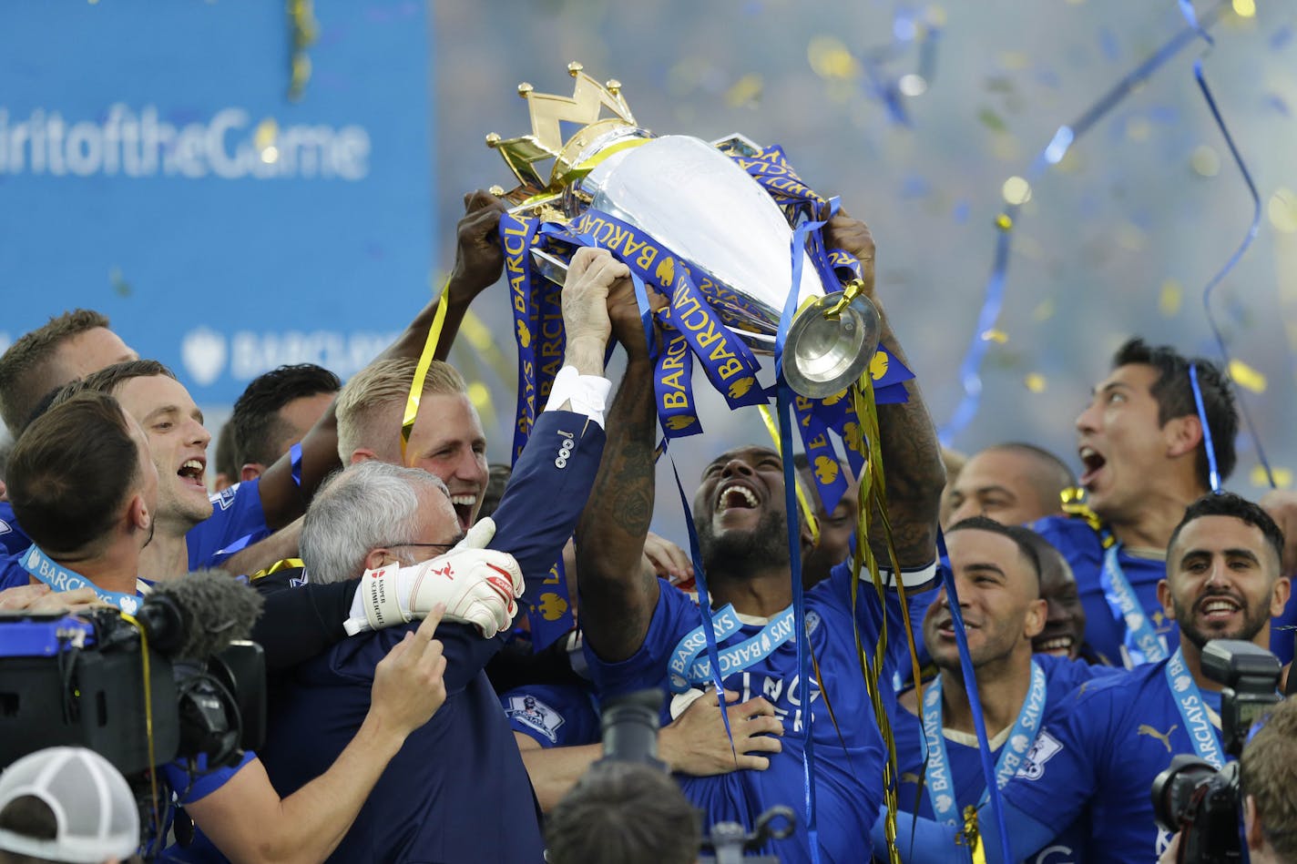 Leicester's Wes Morgan lifted the trophy as Leicester City celebrated becoming the English Premier League soccer champions on May 7, 2016 at King Power Stadium in Leicester, England.