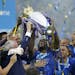 Leicester's Wes Morgan lifted the trophy as Leicester City celebrated becoming the English Premier League soccer champions on May 7, 2016 at King Powe