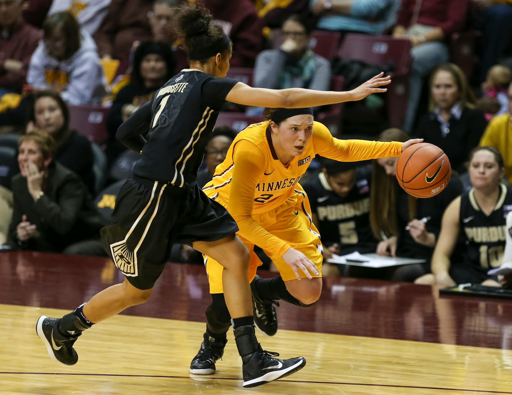 Mikayla Bailey (24) looked for a way past Purdue's Ashley Morrissette (1) during the first half.