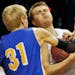Esko's Kory Deadrick (31) and East Grand Forks Jim Warmack tussled for control of a rebound. ] Boys Basketball State Tournament. Class 2A East Grand F