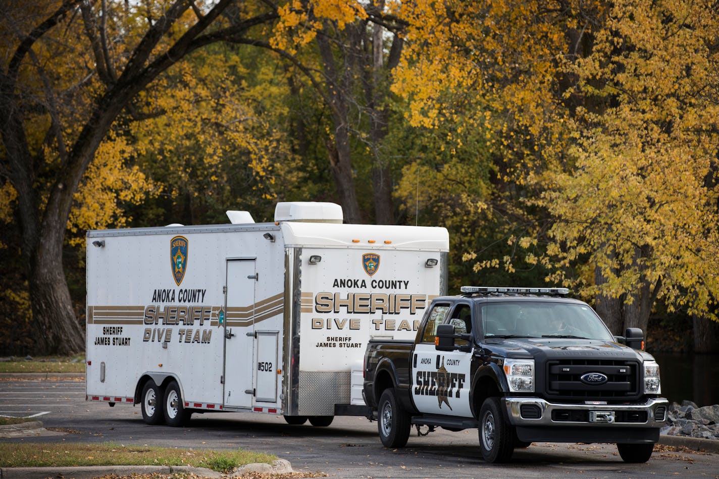 The Anoka County Sheriff's Department dive team vehicle drives away after divers recovered the crashed plane. Sheriff's Department speaks during a press conference at Mississippi Point Park in Champlin on Sunday, October 15, 2017. A small plane crashed in the Mississippi River near Ramsey on Friday evening, and a woman pulled from the water died. The Anoka County Sheriff's Department recovered the plane on Sunday and the body of a man from the Mississippi River.