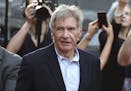 In this December 10, 2015 file photo, Harrison Ford greets fans during a "Star Wars" fan event in Sydney.