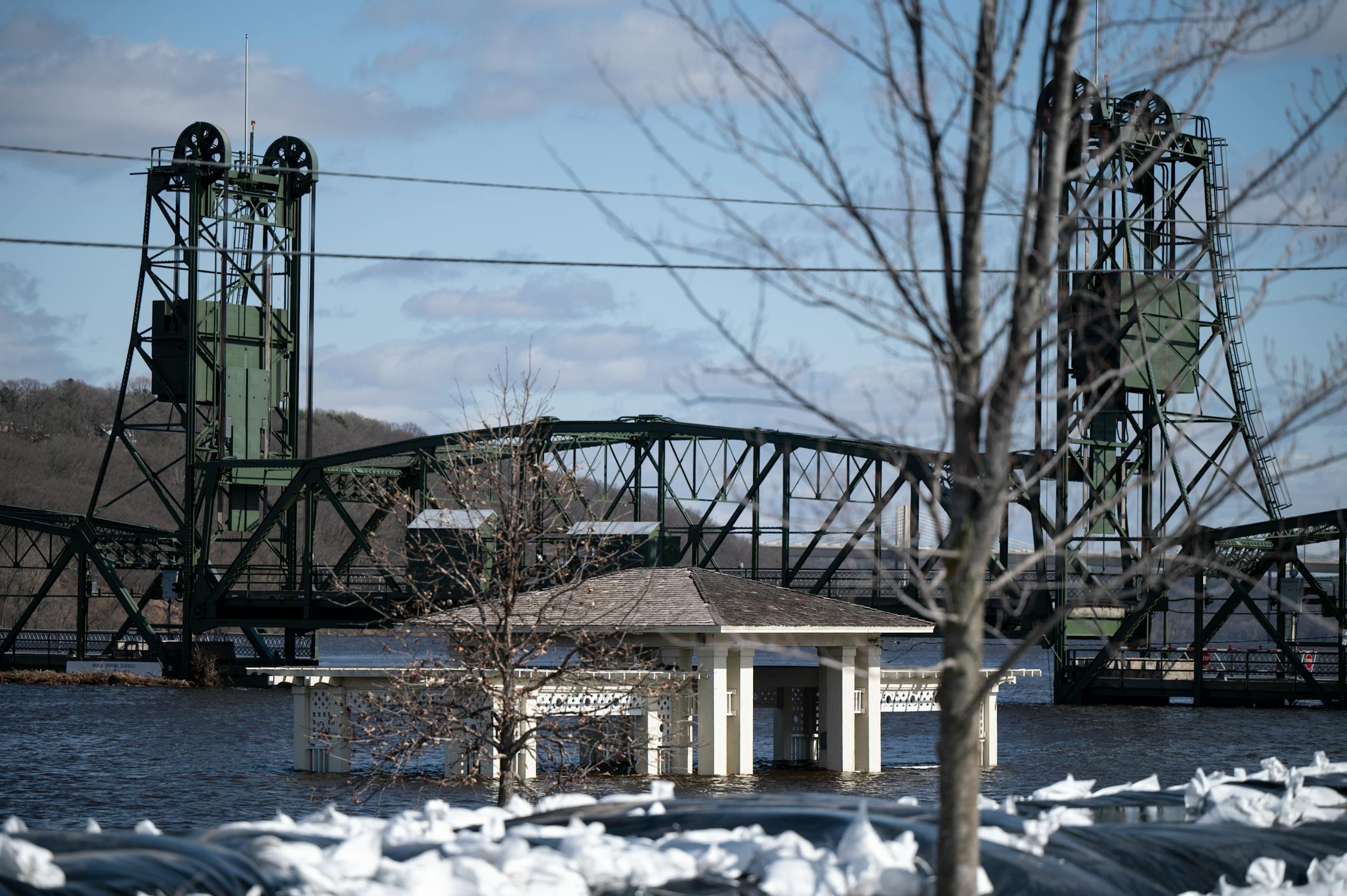 The Lowell Park Gazebo is flooded by the St. Croix River, with water levels rising towards the base of the historic Lift Bridge on Monday, April 17, 2023, in Stillwater.