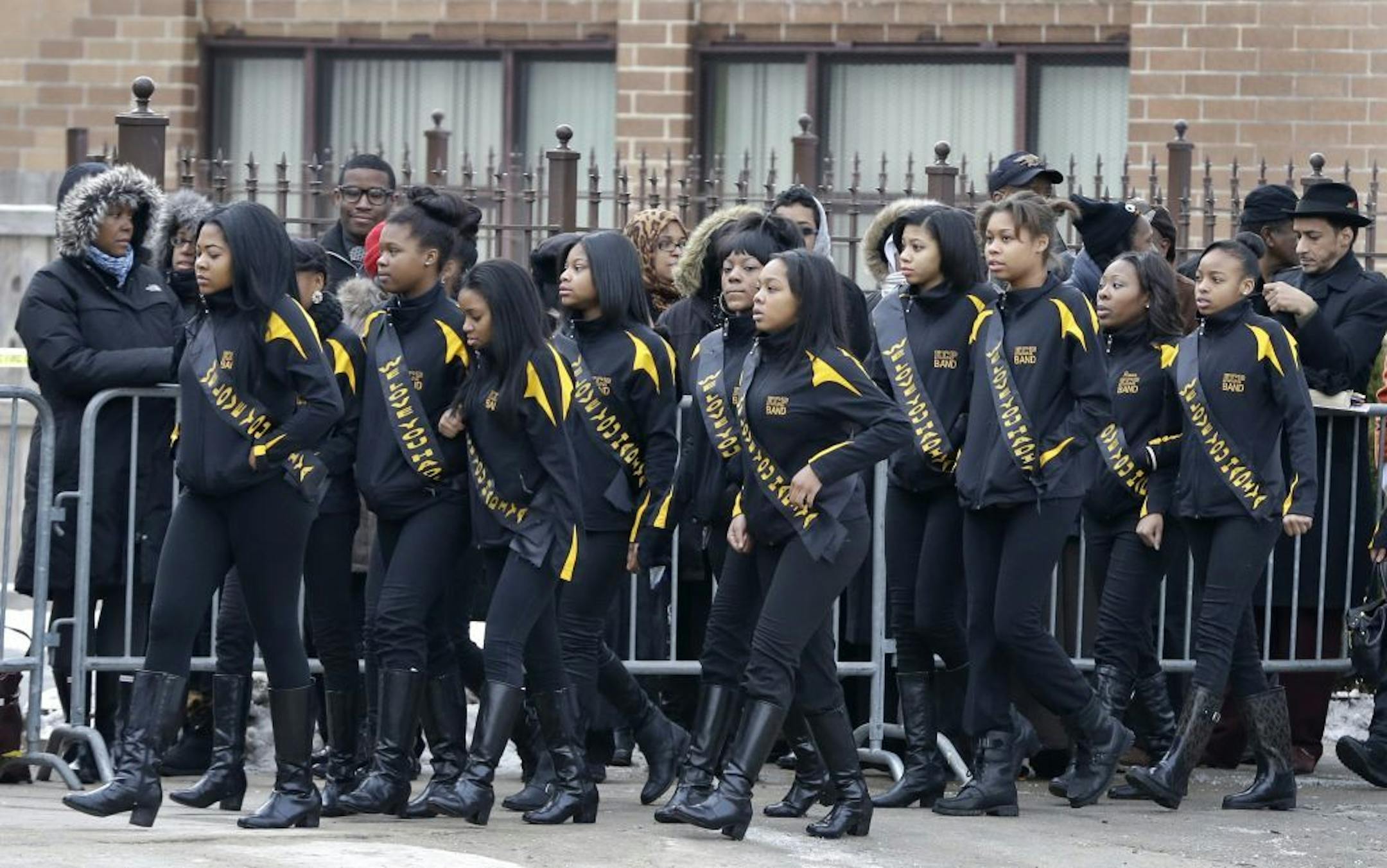 Members of the Crystal Elegance Majorettes arrive at the Greater Harvest Missionary Baptist Church for the funeral service of Hadiya Pendleton, also a member of the majorette team, Saturday, Feb. 9, 2013, in Chicago. The shooting death of the 15-year-old honor student has drawn attention to the staggering gun violence in the nation's third-largest city.