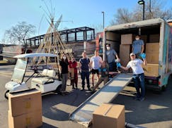 Volunteers from the Boys & Girls Clubs of the Twin Cities unloaded boxes of donations at the Little Earth community in Minneapolis.