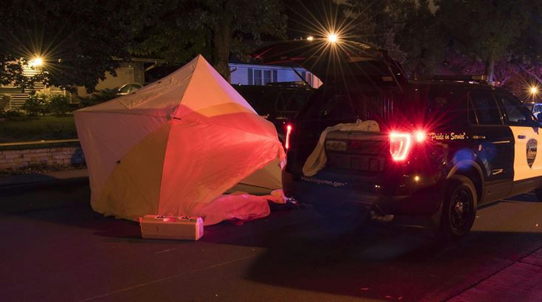 The state Bureau of Criminal Apprehension released photos from the scene where police fatally shot a man in Hastings. His body was concealed by a tent-like covering.