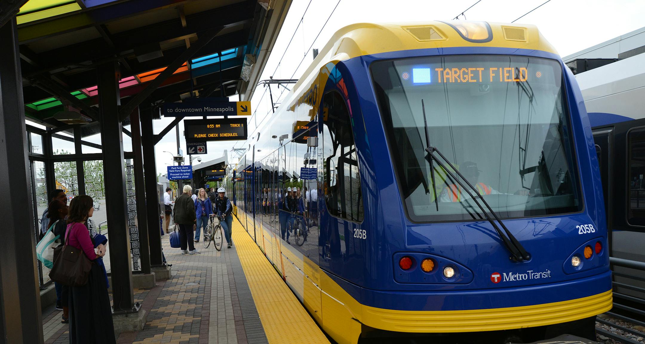 The Hiawatha Light Rail Line is being rebranded as the METRO Blue Line. The Blue Line is the first of the Twin Cities METRO system of rapid transit lines which include METRO Red Line Bus Rapid Transit on Cedar Ave. METRO Blue Line trains will now have three cars and will run every ten minutes throughout most of the day. Twelve new light-rail vehicles dedicated to the line will allow this increased service capacity. During the kickoff event Metro Transit staff handed out Blue line pens, new sched