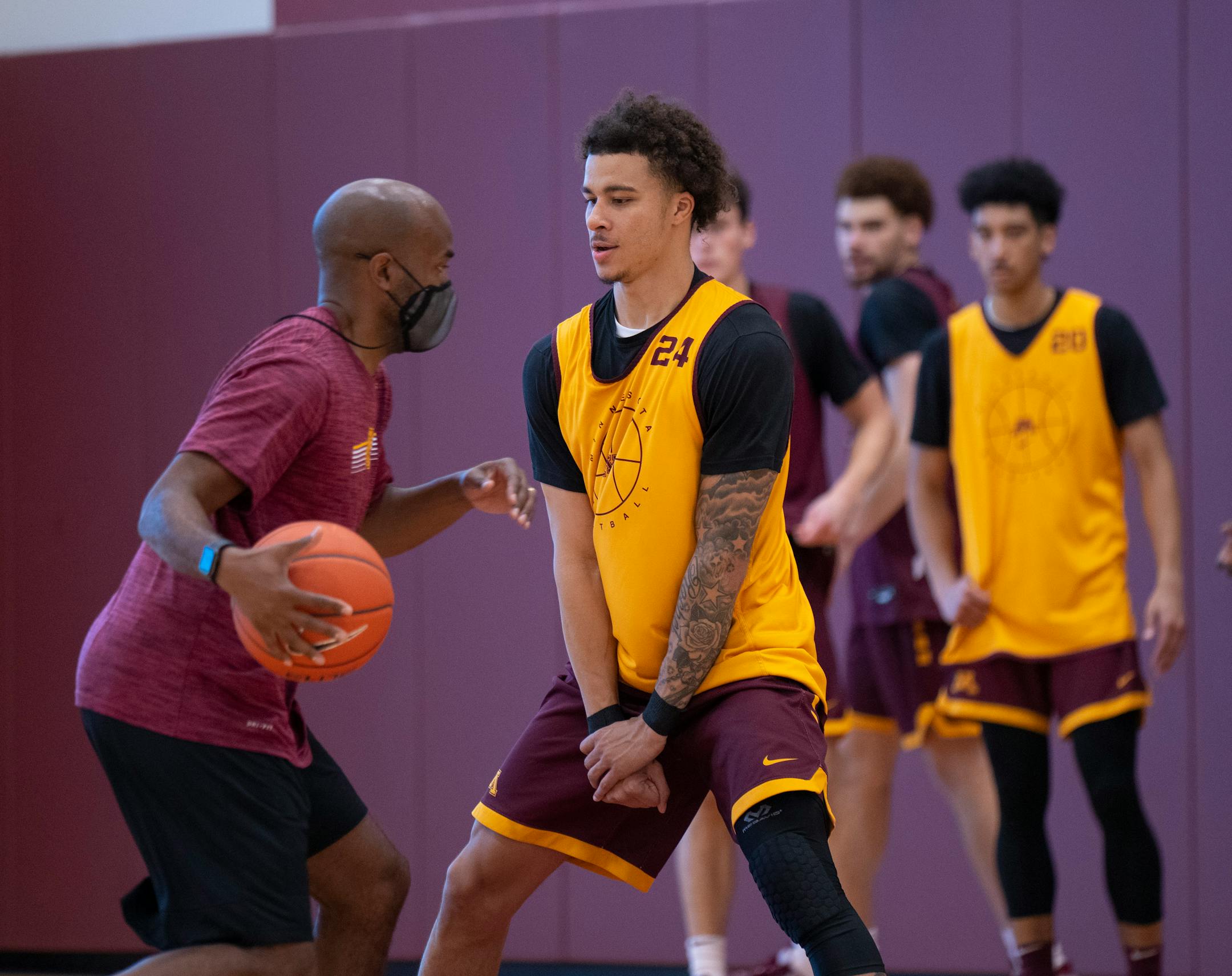 Guard Sean Sutherlin prepared to take a charge from assistant coach Jason Kemp during practice Tuesday afternoon.