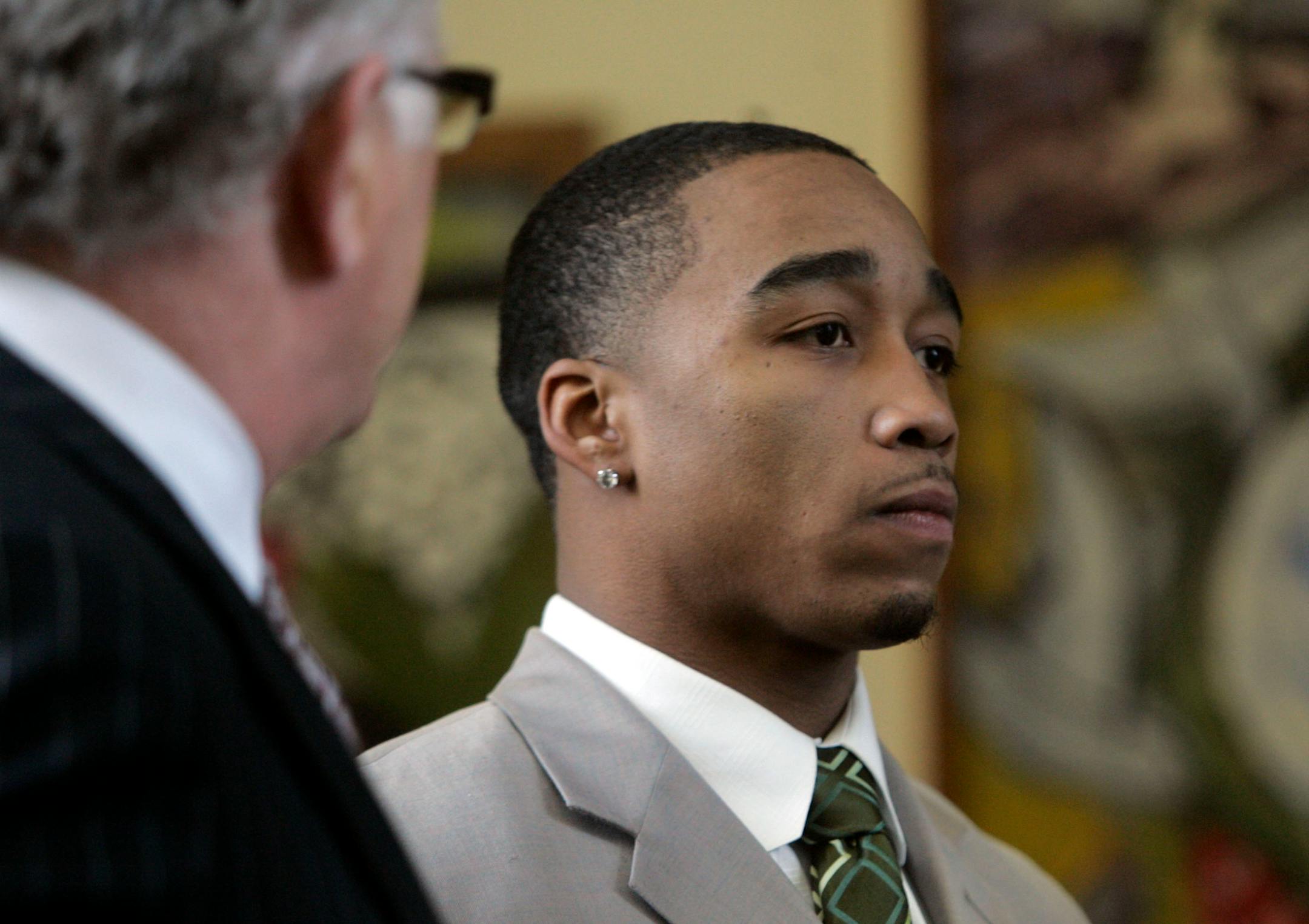 Former U football player Dominic Jones heads for his court appearance in February.