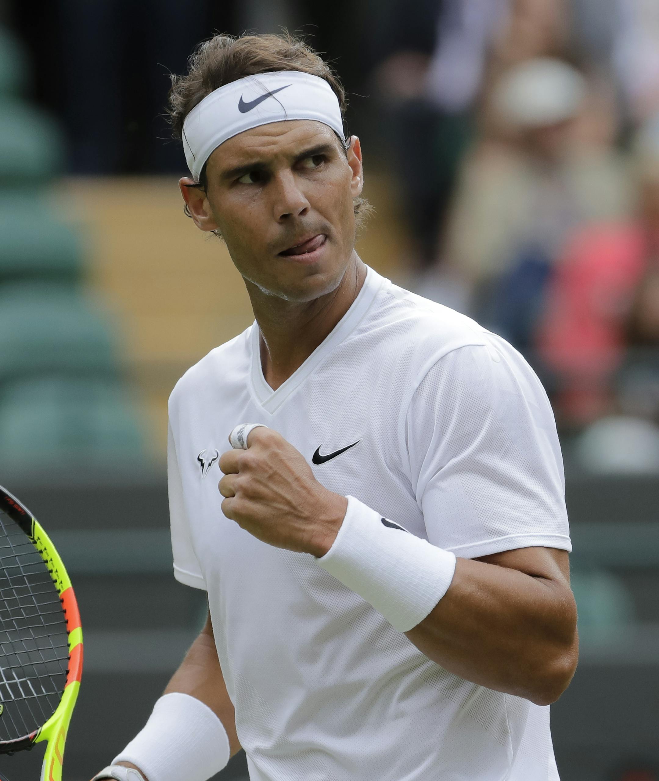 Spain's Rafael Nadal celebrates winning a point during a men's quarterfinal match against United States' Sam Querrey on day nine of the Wimbledon Tennis Championships in London, Wednesday, July 10, 2019. (AP Photo/Ben Curtis)