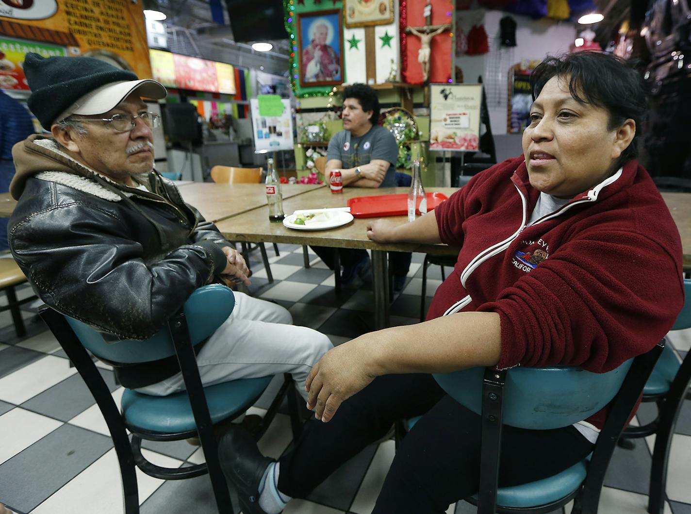 During lunch, Jose Quiroz Cantoran, left, and Candida Mendez, talked and watched CNN in Spanish as they listened to news regarding President Trump's executive orders enabling construction of his proposed wall on the U.S.-Mexico border and targeting cities where local leaders refuse to hand over illegal immigrants for deportation, at Lake Plaza, Wednesday, January 25, 2017 in Minneapolis, MN.