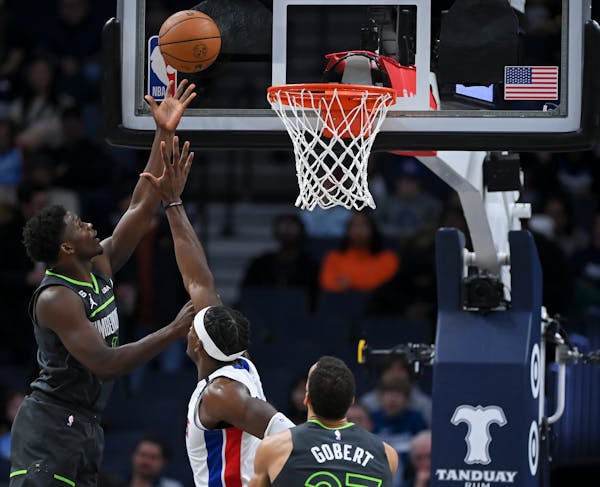 Minnesota Timberwolves guard Anthony Edwards (1) scores a layup during the first half against the Detroit Pistons Saturday, Dec. 31, 2022 at Target Ce