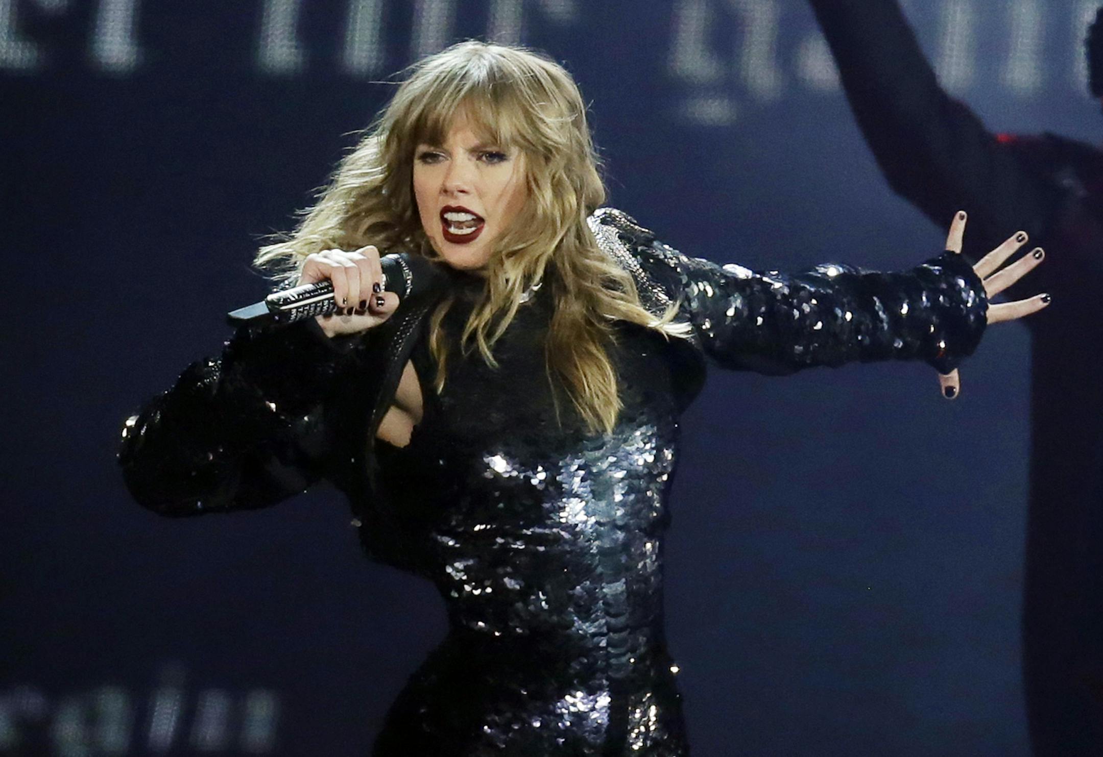 FILE - In this May 8, 2018, file photo, Taylor Swift performs during her "Reputation Stadium Tour" opener in Glendale, Ariz. Swift will open the “2018 American Music Awards.” The singer made the announcement Tuesday, Oct. 2, on ABC’s “Good Morning America.” (Photo by Rick Scuteri/Invision/AP, File)