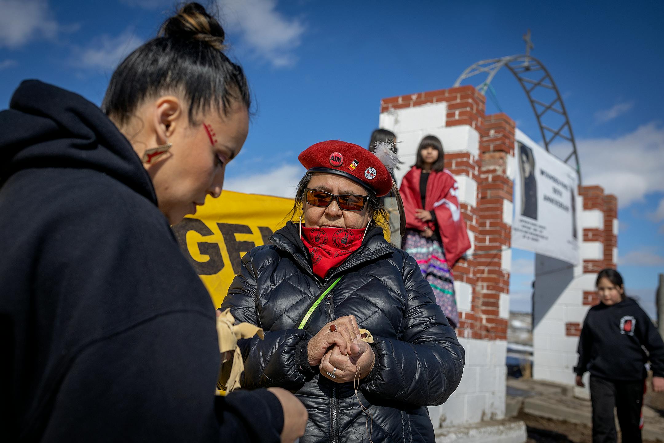 American Indian Movement Minnesota director Lisa Bellanger holds a prayer tobacco to be left at the Wounded Knee site to honor the AIM Warriors of Wounded Knee of 1973 in Wounded Knee, SD on the 50th anniversary.
