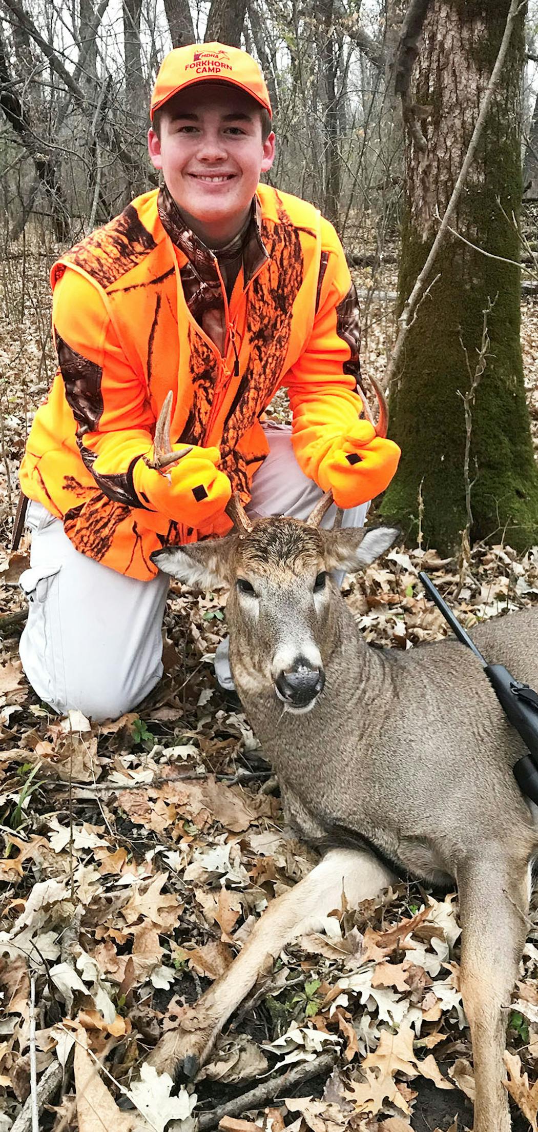 Cooper Laase, 14, harvested this buck in the first half-hour of a hunt in rural Isanti County. His mother shot a four-pointer.