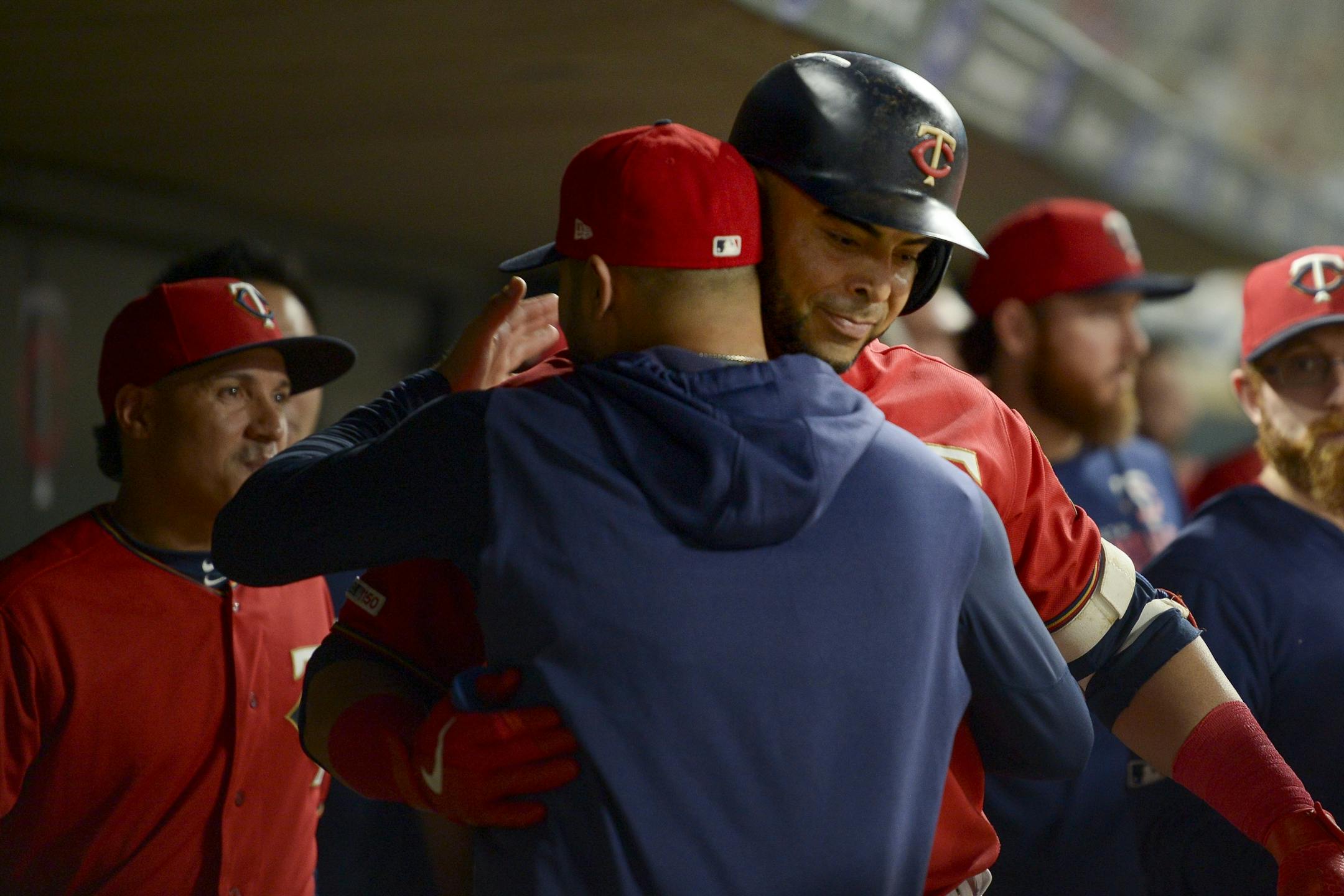 Minnesota Twins designated hitter Nelson Cruz (23) celebrated in the dugout after his 3-run home run against the Kansas City Royals in the bottom of the third inning.