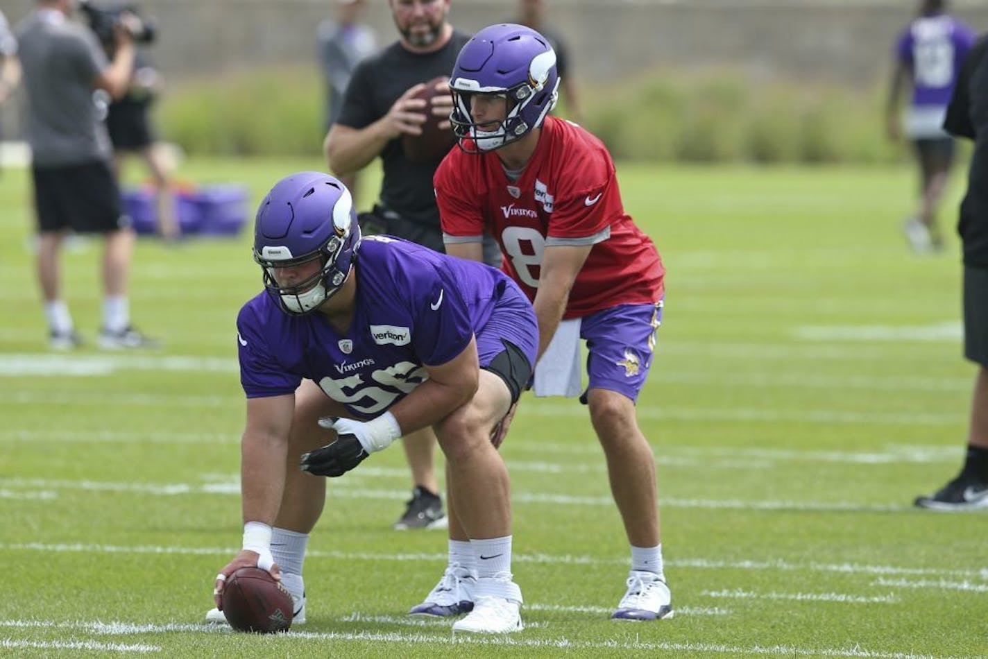 Garrett Bradbury with quarterback Kirk Cousins during training camp last summer.