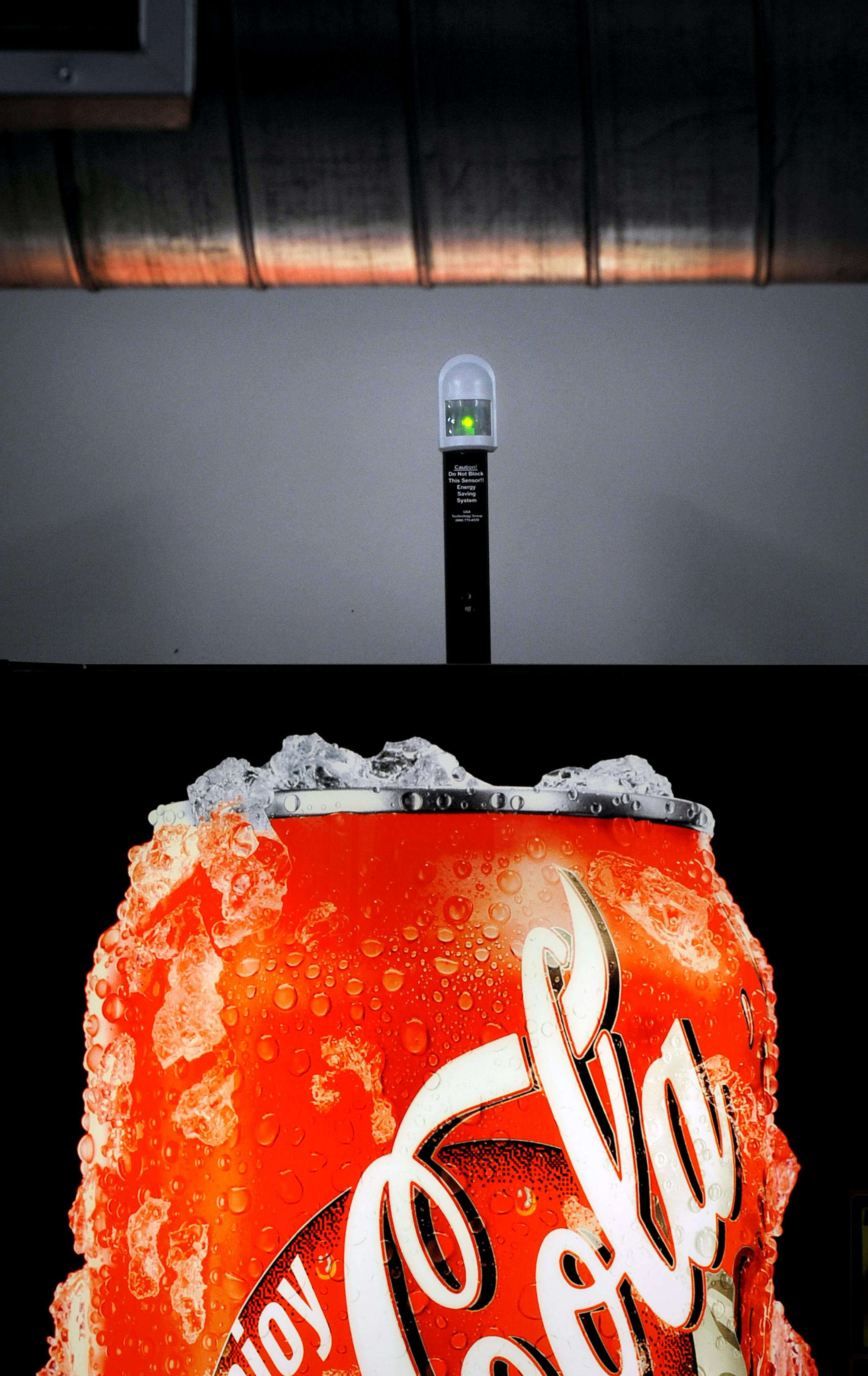 GLEN STUBBE � gstubbe@startribune.com -- Thursday, October 9, 2008 -- Minneapolis, Minn. -- Motion sensors power display lights on and off for employee vending machines at Bolger Printing saving hundreds of dollars each year.