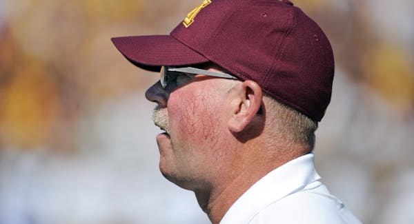 Minnesota coach Jerry Kill watches the action from the sideline during the first half of an NCAA college football game against Middle Tennessee, Satur