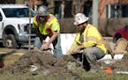 FILE - Construction workers work in Mount Prospect, Ill., Monday, Feb. 26, 2024. On Friday, April 5, 2024, the U.S. government issues its March jobs r